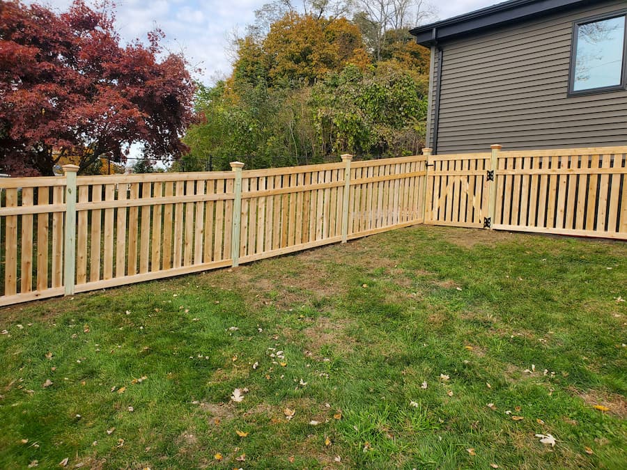 Capped flat board cedar picket fence in Goshen NY